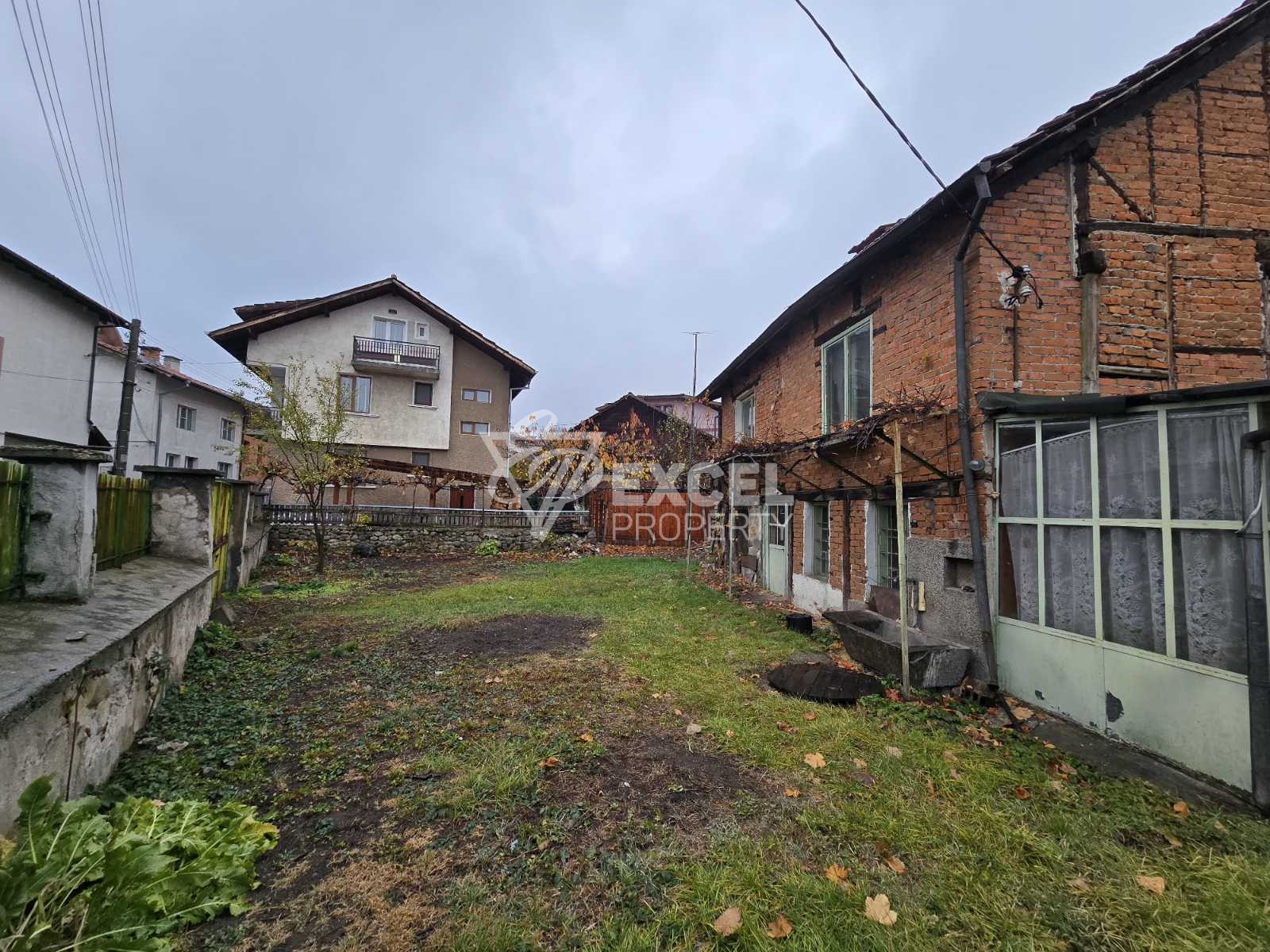 A property with a finished architectural project for a massive three-story house in the center of Bansko