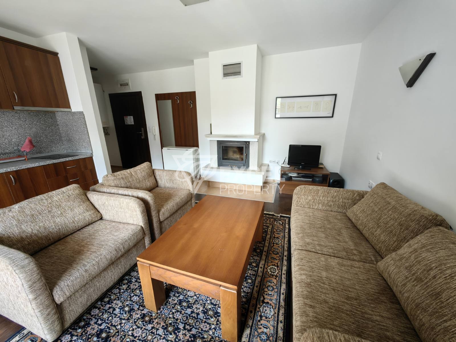 South facing one-bedroom apartment with fireplace in Winslow Infinity gated complex