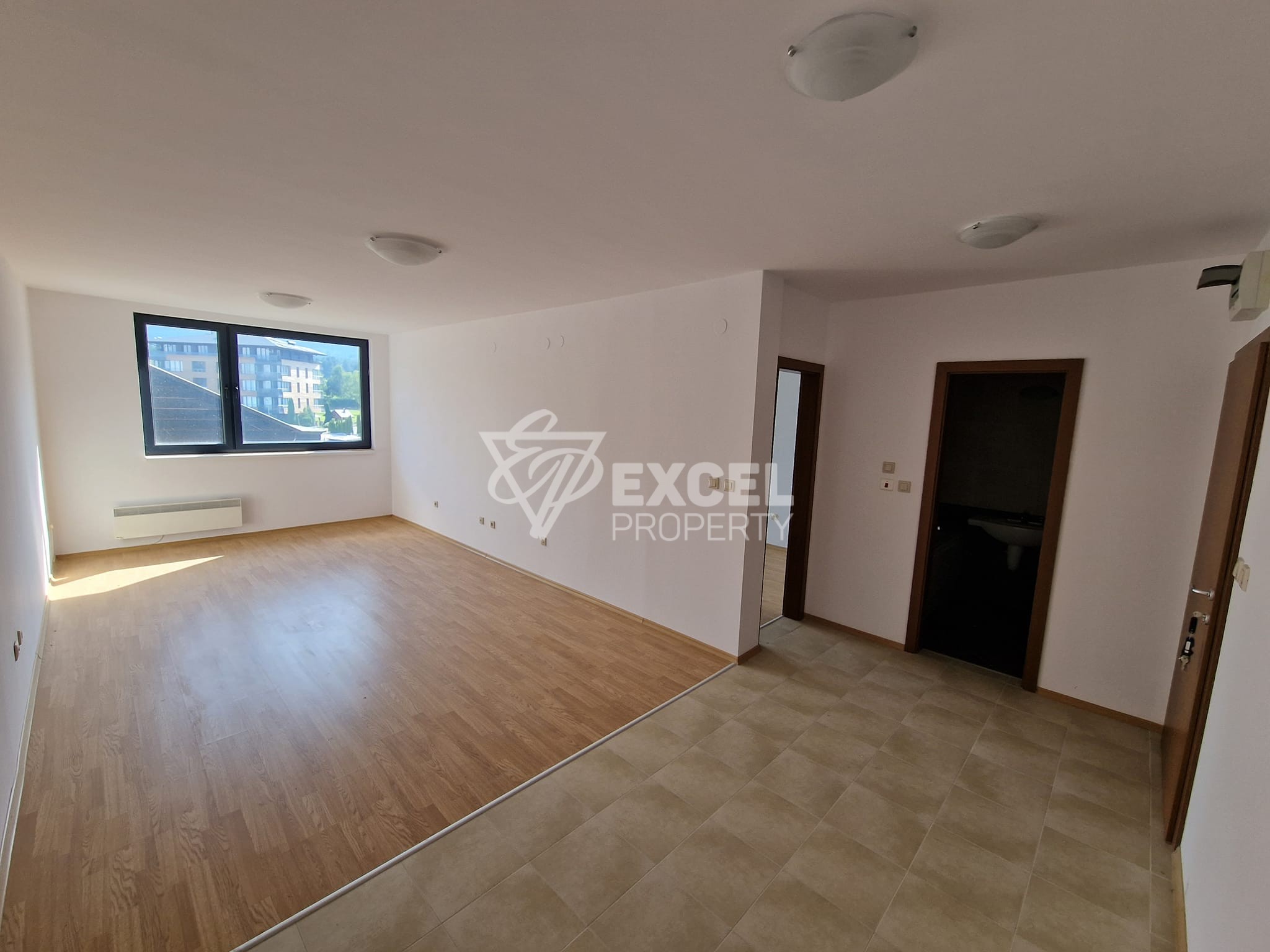 One-bedroom apartment with a frontal view of the Pirin mountain next to the golf course