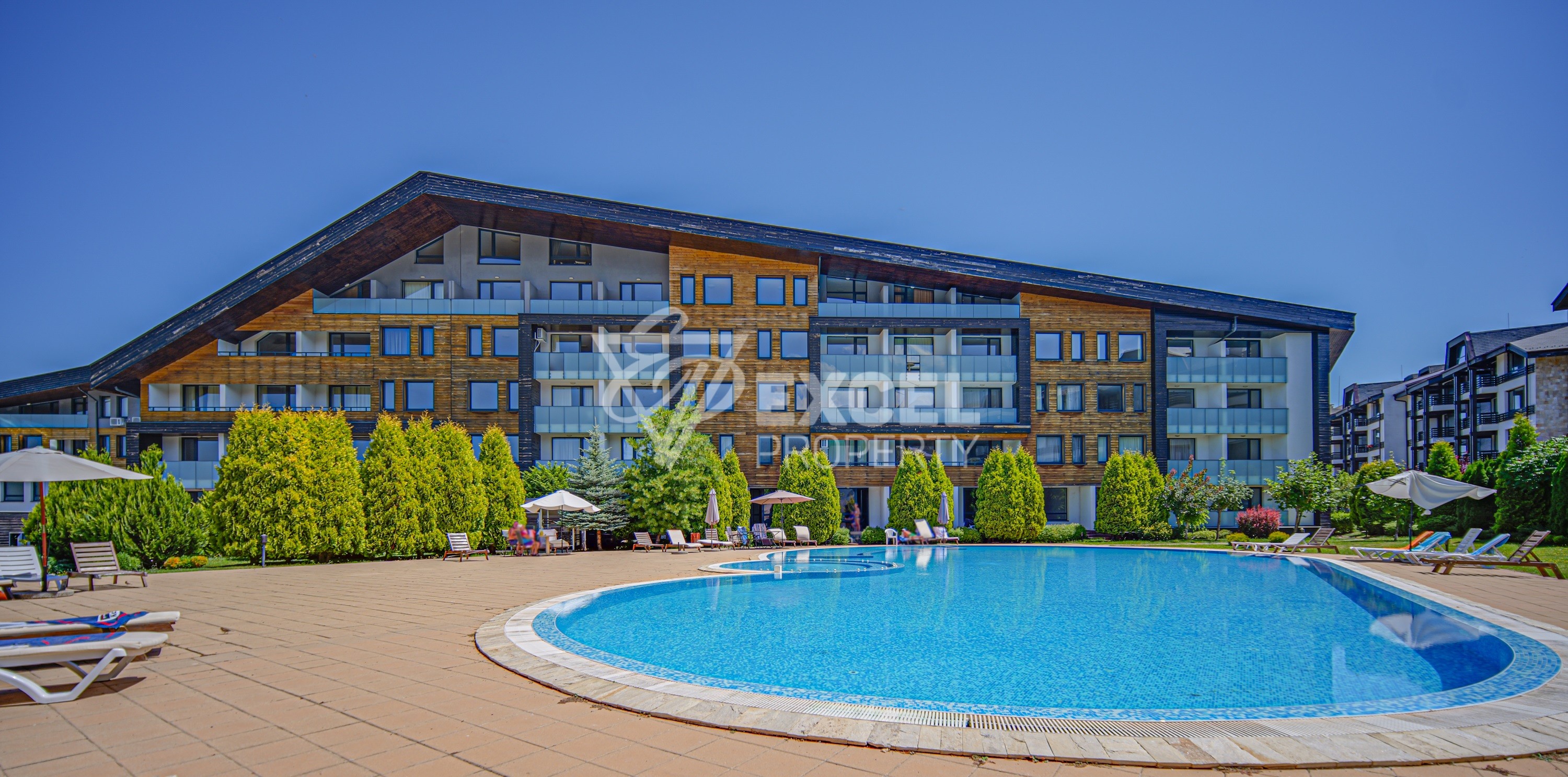 One-bedroom apartment with a frontal view of the Pirin mountain next to the golf course