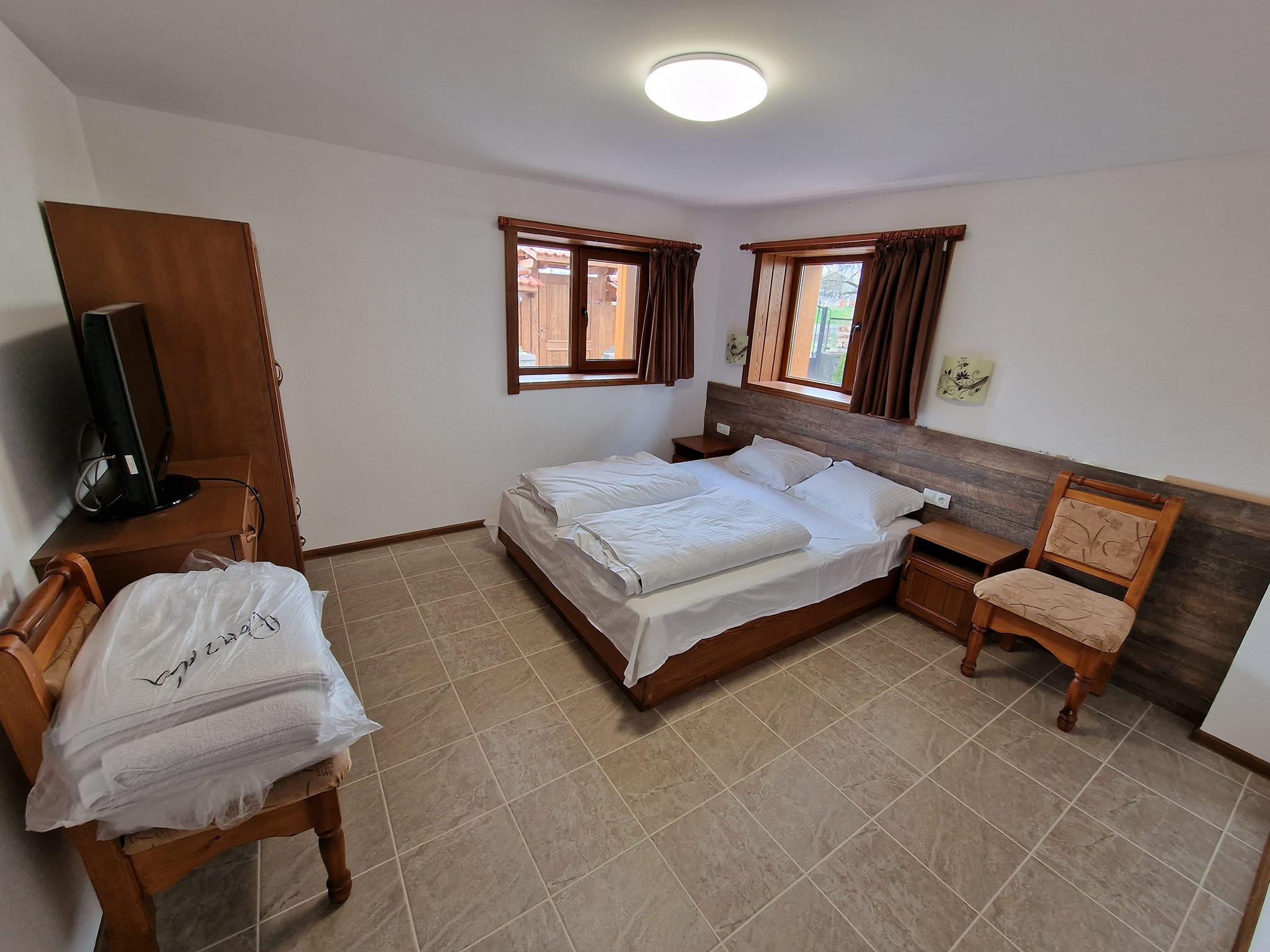 Renovated three-story house with a large yard for sale in the village of Banya, Bansko region