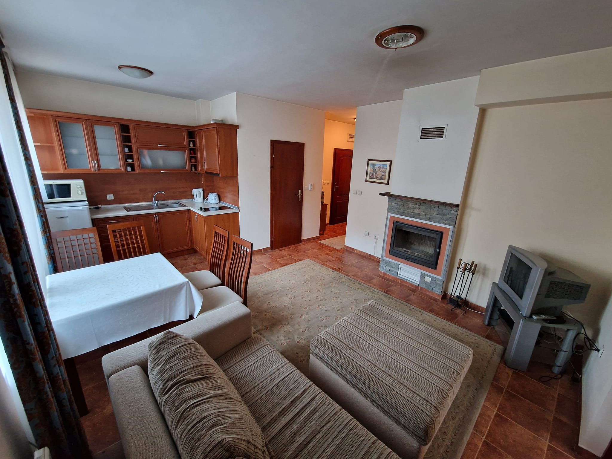 Sunny one bedroom apartment with fireplace for sale in Bansko next to Lucky Hotel