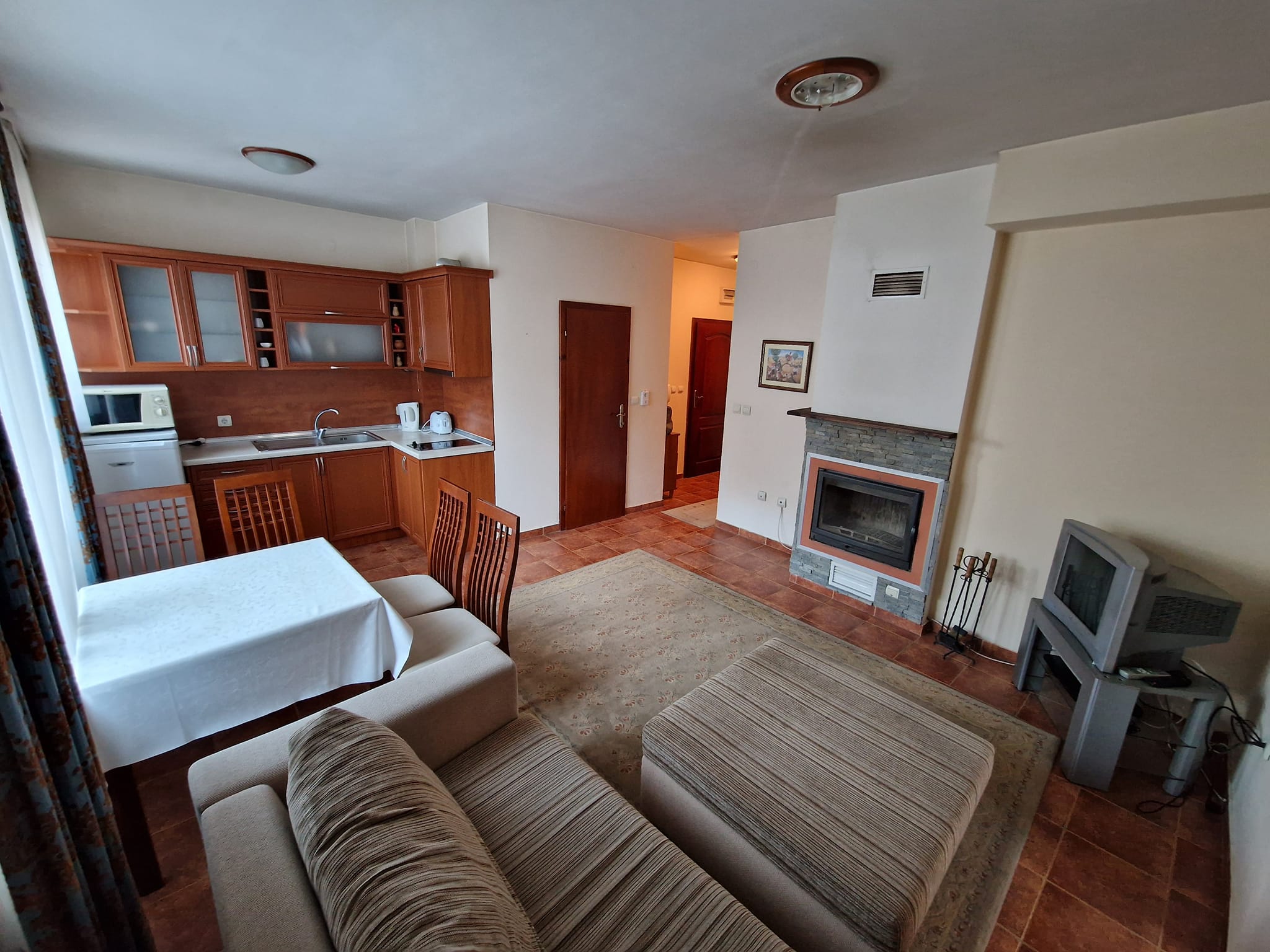 Sunny one bedroom apartment with fireplace for sale in Bansko next to Lucky Hotel