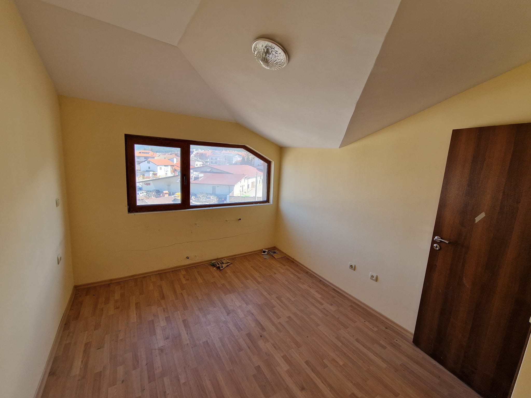 Southeast unfurnished property for sale with low maintenance fee in Bansko next to the ski lift