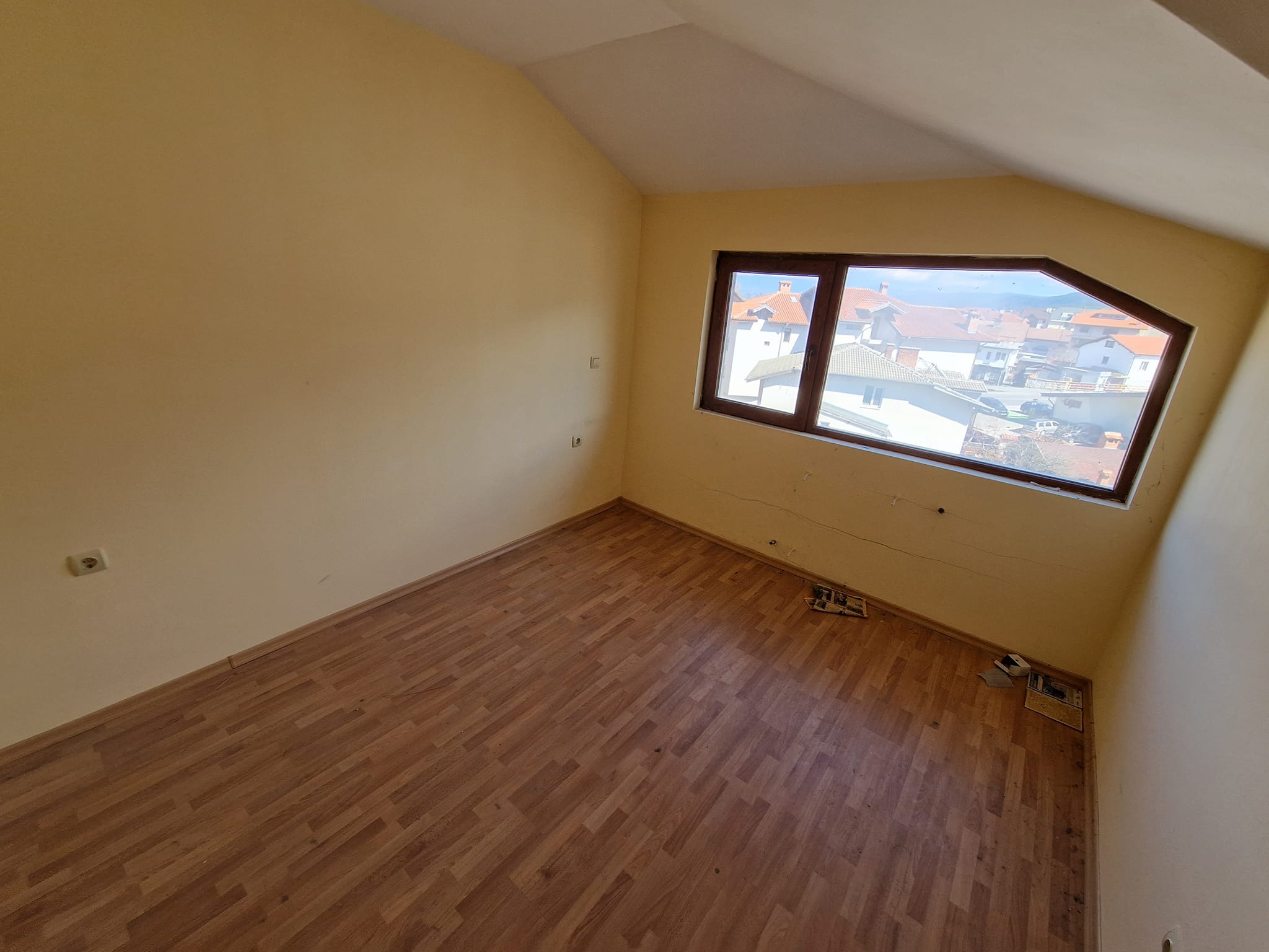 Southeast unfurnished property for sale with low maintenance fee in Bansko next to the ski lift