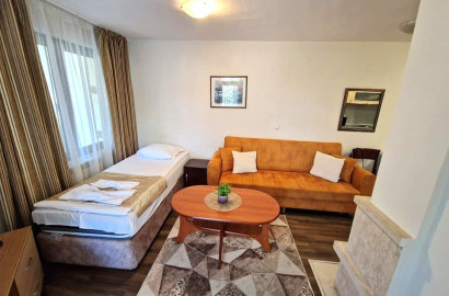 Furnished one bedroom apartment with a fireplace in a gated complex with a pool