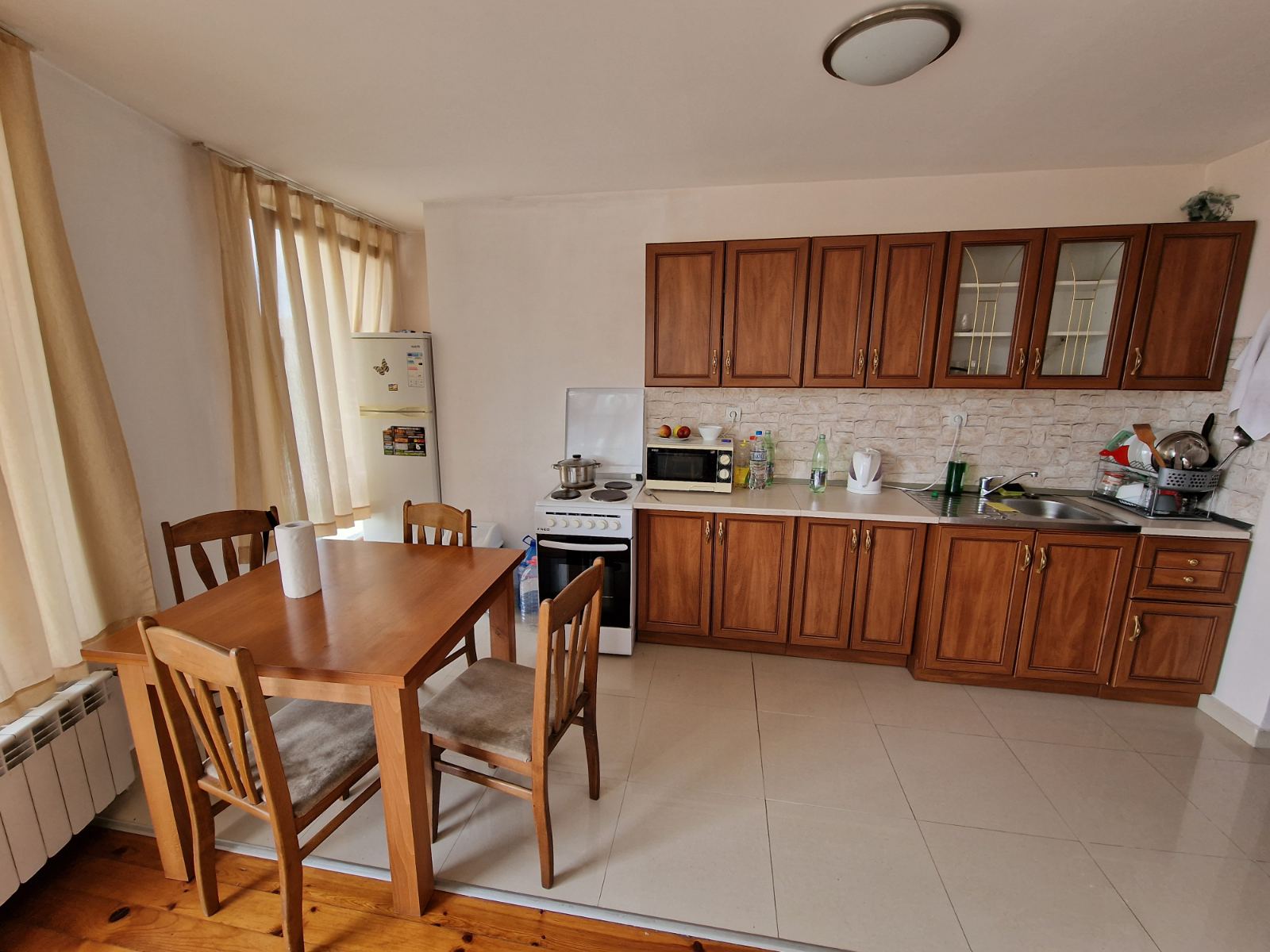 Spacious apartment with two bedrooms and a parking space in a well-maintained complex in Bansko