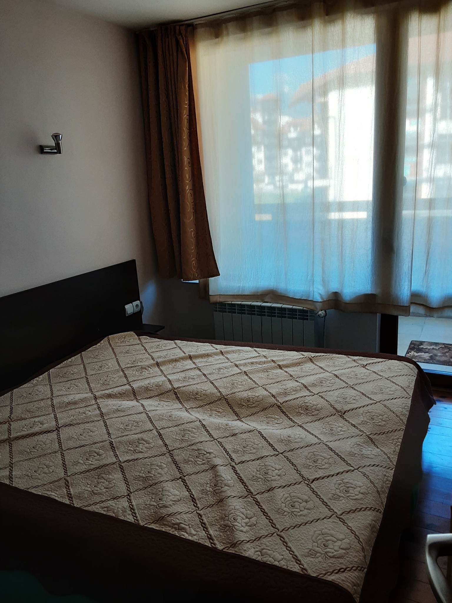 Spacious apartment with two bedrooms and a parking space in a well-maintained complex in Bansko