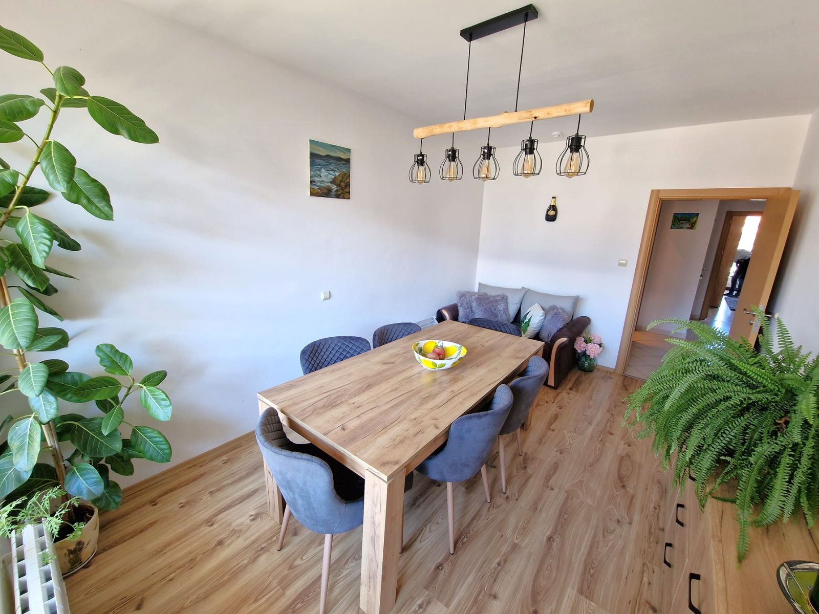 A modern, cozy two bedroom apartment with new furniture and a frontal view of the Pirin Mountains