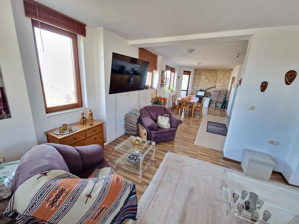 A unique three bedroom apartment with a stunning view of three mountains and the city of Bansko