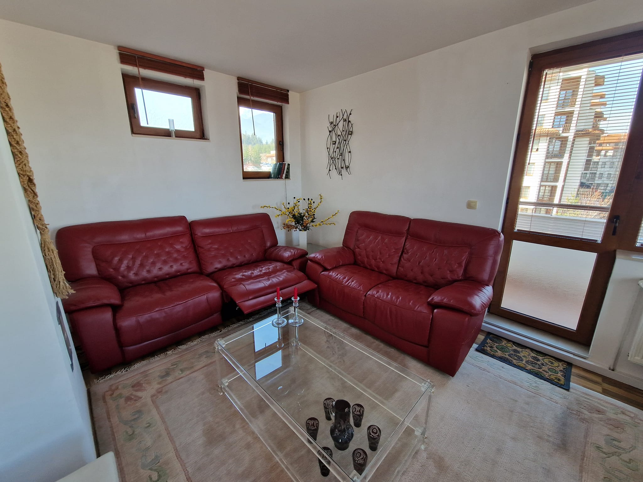 A unique three bedroom apartment with a stunning view of three mountains and the city of Bansko