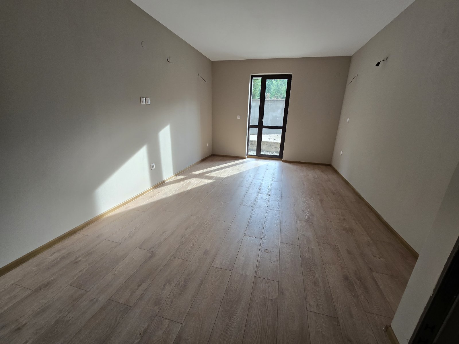 Three-room apartment with a veranda in a new residential building with a low maintenance fee